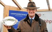 29 January 2012; Trainer Willie Mullins holds the winning trophy after he sent out Hurricane Fly to win the BHP Insurance Irish Champion Hurdle. Leopardstown Racecourse, Leopardstown, Co. Dublin. Picture credit: Barry Cregg / SPORTSFILE