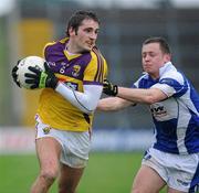 29 January 2012; Brian Malone, Wexford, in action against Damien O'Connor, Laois. Bord Na Mona O'Byrne Shield Final, Wexford v Laois, Wexford Park, Wexford. Picture credit: Matt Browne / SPORTSFILE