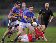 29 January 2012; Sean Carey, Tipperary, in action against Liam Shorten, Cork. McGrath Cup Football Final, Tipperary v Cork, Clonmel Sportsfield, Clonmel, Co. Tipperary. Picture credit: Stephen McCarthy / SPORTSFILE
