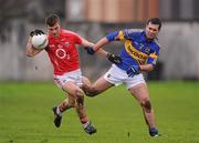 29 January 2012; Fiachra Lynch, Cork, in action against Seamus Grogan, Tipperary. McGrath Cup Football Final, Tipperary v Cork, Clonmel Sportsfield, Clonmel, Co. Tipperary. Picture credit: Stephen McCarthy / SPORTSFILE