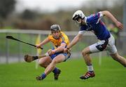 29 January 2012; Jonathan Clancy, Clare, in action against Stephen O'Keeffe, Waterford Institute of Technology. Waterford Crystal Cup Hurling, Preliminary Round, Clare v Waterford Institute of Technology, O'Garney Park, Sixmilebridge, Co. Clare. Picture credit: Ray McManus / SPORTSFILE