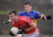 29 January 2012; Fiachra Lynch, Cork, in action against John O'Callaghan, Tipperary. McGrath Cup Football Final, Tipperary v Cork, Clonmel Sportsfield, Clonmel, Co. Tipperary. Picture credit: Stephen McCarthy / SPORTSFILE