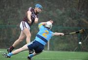 29 January 2012; Conor Cooney, Galway, scores one of his side's six goals, despite the challenge of Diarmuid Nash, University College Dublin. Bord na Mona Walsh Cup, University College Dublin v Galway, UCD, Belfield, Co. Dublin. Picture credit: Dáire Brennan / SPORTSFILE