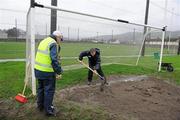 29 January 2012; Brian White and Martin Quinlivan, left, spreads sand in the goalmouth area ahead of the game. McGrath Cup Football Final, Tipperary v Cork, Clonmel Sportsfield, Clonmel, Co. Tipperary. Picture credit: Stephen McCarthy / SPORTSFILE