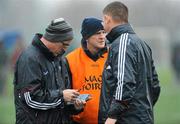 29 January 2012; Galway manager Anthony Cunningham, left, goes through the programme with selectors Mattie Kenny and Tom Helebert, right, at half time. Bord na Mona Walsh Cup, University College Dublin v Galway, UCD, Belfield, Co. Dublin. Picture credit: Dáire Brennan / SPORTSFILE