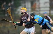 29 January 2012; Johnny Coen, Galway, is fouled by James Gilligan, University College Dublin, which resulted in a penalty for Galway. Bord na Mona Walsh Cup, University College Dublin v Galway, UCD, Belfield, Co. Dublin. Picture credit: Dáire Brennan / SPORTSFILE