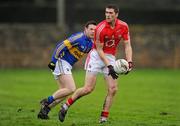 29 January 2012; Conor O'Driscoll, Cork, in action against Sean Carey, Tipperary. McGrath Cup Football Final, Tipperary v Cork, Clonmel Sportsfield, Clonmel, Co. Tipperary. Picture credit: Stephen McCarthy / SPORTSFILE