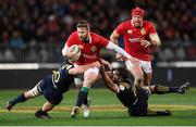 13 June 2017; Elliot Daly of the British & Irish Lions in action against Jimmy Lentjes, left, and  Luke Whitelock of the Highlanders during the match between the Highlanders and the British & Irish Lions at Forsyth Barr Stadium in Dunedin, New Zealand. Photo by Stephen McCarthy/Sportsfile