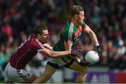 11 June 2017; Donal Vaughan of Mayo in action against Fiontán Ó Curraoin of Galway during the Connacht GAA Football Senior Championship Semi-Final match between Galway and Mayo at Pearse Stadium, in Salthill, Galway. Photo by Ray McManus/Sportsfile