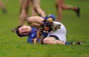 29 January 2012; Ciaran McDonnell, Tipperary, goes to ground with an injury. McGrath Cup Football Final, Tipperary v Cork, Clonmel Sportsfield, Clonmel, Co. Tipperary. Picture credit: Stephen McCarthy / SPORTSFILE