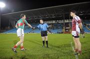 27 January 2012; Mayo captain Alan Dillon shakes hands with referee Michael Duffy before the start of the game, as N.U.I. Galway captain Kieran McDonald looks on. FBD Insurance League Home Final, N.U.I. Galway v Mayo, McHale Park, Castlebar, Co. Mayo. Photo by Sportsfile
