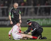 28 January 2012; Michael Murphy, Tyrone, being attended to by Michael Harte, Tyrone physio, as Referee Martin Higgins watches on. Power NI Dr. McKenna Cup Final, Derry v Tyrone, Morgan Athletic Grounds, Armagh. Picture credit: Oliver McVeigh / SPORTSFILE