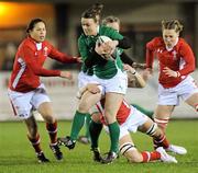 3 February 2012; Lynne Cantwell, Ireland, is tackled by Rachel Taylor, Charlie Murray and Jamie Kift, Wales. Women's Six Nations Championship, Ireland v Wales, Ashbourne RFC, Ashbourne, Co. Meath. Picture credit: Matt Browne / SPORTSFILE