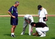 13 June 2002; Republic of Ireland manager Mick McCarthy and Brendan Menton, FAI Chief Executive, second from left, with military personal check the condition of the pitch following a Republic of Ireland training session at Sangok-dong Military Sports Facility in Seoul, South Korea. Photo by David Maher/Sportsfile