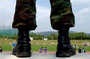 13 June 2002; A Korean solidier watches on from a hillside during a Republic of Ireland training session at Sangok-dong Military Sports Facility in Seoul, South Korea. Photo by David Maher/Sportsfile