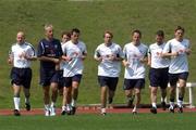 13 June 2002; Republic of Ireland manager Mick McCarthy leads his players, including Lee Carsley, Ian Harte, Jason McAteer and Matt Holland, during a Republic of Ireland training session at Sangok-dong Military Sports Facility in Seoul, South Korea. Photo by David Maher/Sportsfile