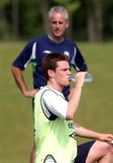 13 June 2002; Steve Finnan, watched by manager Mick McCarthy, during a Republic of Ireland training session at Sangok-dong Military Sports Facility in Seoul, South Korea. Photo by David Maher/Sportsfile