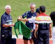 13 June 2002; Republic of Ireland manager Mick McCarthy, centre, presents a jersey to Military personnel prior to a Republic of Ireland training session at Sangok-dong Military Sports Facility in Seoul, South Korea. Photo by David Maher/Sportsfile