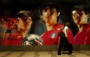 13 June 2002; A passer-by walks past a giant poster of South Korea players soccer team a Republic of Ireland press conference at the Westin Chosun Hotel in Seoul, South Korea. Photo by David Maher/Sportsfile