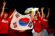 14 June 2002; South Korea supporters celebrate their side's qualification for the FIFA World Cup 2002 Round of 16, following victory over Portugal in their Group D match. Photo by David Maher/Sportsfile