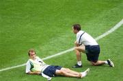 15 June 2002; Jason McAteer, left, and David Connolly relax during a training session at Suwon World Cup Stadium in Suwon, South Korea, prior to their FIFA World Cup 2002 Round of 16 match between Spain. Photo by David Maher/Sportsfile