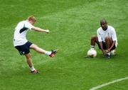 15 June 2002; Damien Duff practices his penalty kicks in front of team-mate Clinton Morrison during a training session at Suwon World Cup Stadium in Suwon, South Korea, prior to their FIFA World Cup 2002 Round of 16 match between Spain. Photo by David Maher/Sportsfile