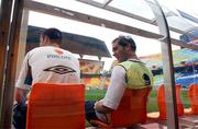 15 June 2002; Gary Breen, left, and Jason McAteer of Republic of Ireland relax on the team bench during a training session at Suwon World Cup Stadium in Suwon, South Korea, prior to their FIFA World Cup 2002 Round of 16 match between Spain. Photo by David Maher/Sportsfile