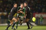 15 June 2002; Brian O'Driscoll of Ireland, is tackled by Caleb Ralph, left, and Aaron Mauger of New Zealand during the Summer Tour 2002 1st Test match between New Zealand and Ireland at Carisbrook in Dunedin, Otago, New Zealand. Photo by Matt Browne/Sportsfile