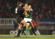 15 June 2002; Girvan Dempsey of Ireland is tackled by Aaron Mauger, left, and Scott Robertson of New Zealand during the Summer Tour 2002 1st Test match between New Zealand and Ireland at Carisbrook in Dunedin, Otago, New Zealand. Photo by Matt Browne/Sportsfile
