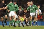15 June 2002; Andrew Mehrtens of New Zealand is tackled by Brian O'Driscoll of Ireland during the Summer Tour 2002 1st Test match between New Zealand and Ireland at Carisbrook in Dunedin, Otago, New Zealand. Photo by Matt Browne/Sportsfile