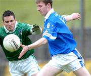 15 June 2002; Gerald Pierson of Cavan in action against Limerick's Mark O'Riordan during the Bank of Ireland All-Ireland Senior Football Championship Qualifier Round 1 Replay match between Cavan and Limerick at Breffni Park in Cavan. Photo by Aoife Rice/Sportsfile