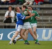 15 June 2002; Jason Reilly of Cavan in action against Limerick's Damien Reidy during the Bank of Ireland All-Ireland Senior Football Championship Qualifier Round 1 Replay match between Cavan and Limerick at Breffni Park in Cavan. Photo by Aoife Rice/Sportsfile