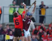 15 June 2002; Mark Kerins of Galway in action against Gary Savage of Down during the Guinness All-Ireland Senior Hurling Championship Qualifing Round 1 match between Galway and Down at Casement Park in Belfast. Photo by Damien Eagers/Sportsfile