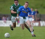 15 June 2002; Damien Reidy of Cavan in action against Limerick's Cathal Collins during the Bank of Ireland All-Ireland Senior Football Championship Qualifier Round 1 Replay match between Cavan and Limerick at Breffni Park in Cavan. Photo by Aoife Rice/Sportsfile