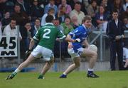 15 June 2002; Derald Pierson of Cavan in action against Limerick's Mark O'Riordan during the Bank of Ireland All-Ireland Senior Football Championship Qualifier Round 1 Replay match between Cavan and Limerick at Breffni Park in Cavan. Photo by Aoife Rice/Sportsfile