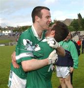 15 June 2002; Johnny Murphy, left, and Conor Fitzgerald celebrate following their side's victory during the Bank of Ireland All-Ireland Senior Football Championship Qualifier Round 1 Replay match between Cavan and Limerick at Breffni Park in Cavan. Photo by Aoife Rice/Sportsfile