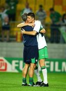 16 June 2002; Republic of Ireland manager Mick McCarthy consoles Niall Quinn following their side's defeat during the FIFA World Cup 2002 Round of 16 match between Spain and Republic of Ireland at Suwon World Cup Stadium in Suwon, South Korea. Photo by David Maher/Sportsfile