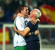 16 June 2002; Republic of Ireland physio Mick Byrne consoles Kevin Kilbane following their side's defeat during the FIFA World Cup 2002 Round of 16 match between Spain and Republic of Ireland at Suwon World Cup Stadium in Suwon, South Korea. Photo by David Maher/Sportsfile