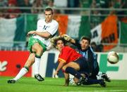 16 June 2002; Kevin Kilbane of Republic of Ireland has a shot on goal, under pressure from Spain goalkeeper Iker Casillas and defender Carles Puyol, during the FIFA World Cup 2002 Round of 16 match between Spain and Republic of Ireland at Suwon World Cup Stadium in Suwon, South Korea. Photo by David Maher/Sportsfile