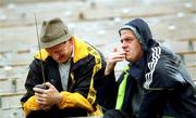 16 June 2002; Derry supporters Kevin Moran, left, and Joe McVey listen on a radio to the FIFA World Cup 2002 Round of 16 match between Spain and Republic of Ireland in South Korea, prior to the Ulster Football Championship Semi-Final match between Donegal and Derry St TiernachÕs Park in Clones, Monaghan. Photo by Damien Eagers/Sportsfile