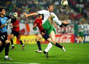 16 June 2002; Robbie Keane of Republic of Ireland in action against Iker Casillas of Spain during the FIFA World Cup 2002 Round of 16 match between Spain and Republic of Ireland at Suwon World Cup Stadium in Suwon, South Korea. Photo by David Maher/Sportsfile