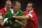 16 June 2002; Liam Hassett of Kerry in action against Ciaran O'Sullivan of Cork during the Bank of Ireland Munster Senior Football Championship Semi-Final match between Kerry and Cork at Fitzgerald Stadium in Killarney, Kerry. Photo by Brendan Moran/Sportsfile