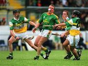 15 June 2002; Paul Donnelly of Meath in action against Offaly's Damien Murray, right, and Stephen Brown during the Guinness All-Ireland Senior Hurling Championship Qualifying Round 1 match between Meath and Offaly at Páirc Tailteann in Navan, Meath. Photo by Aoife Rice/Sportsfile