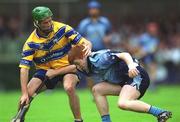 15 June 2002; Derek O'Reilly of Dublin in action against Conor Earlie of Clare during the Guinness All-Ireland Senior Hurling Championship Qualifying Round 1 match between Clare and Dublin at Parnell Park in Dublin. Photo by Ray McManus/Sportsfile