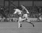27 July 1986; Dave Synnott of Dublin is tackled by Meath's Finian Murtagh during the GAA Leinster Senior Football Championship Final match between Meath and Dublin at Croke Park in Dublin. Photo by Ray McManus/Sportsfile