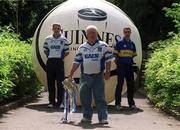 19 June 2002; Giant Among Men for 2001, Michael O'Faolain, from Dungarvan, Co. Waterford, centre, pictured earlier today, alongside Hurling giants Ken McGrath of Waterford, left, and Thomas Dunne of Tipperary, right, to launch the nationwide 2002 Guinness &quot;Giant Among Fans&quot; promotion. Michael faught off stiff competition from hurling supporters from other counties when he was crowned Ireland's number 1 hurling supporter last year in the Guinness Storehouse the night before the All-Ireland Hurling Final. Photo by Brendan Moran/Sportsfile