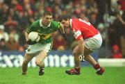 16 June 2002; Marc î SŽ of Kerry evades the tackle of Cork's Fionan Murray during the Bank of Ireland Munster Senior Football Championship Semi-Final match between Kerry and Cork at Fitzgerald Stadium in Killarney, Kerry. Photo by Brendan Moran/Sportsfile