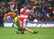16 June 2002; Gareth Doherty of Derry of in action against Christy Toye of Donegal during the Bank of Ireland Ulster Senior Football Championship Semi-Final match between Donegal and Derry at St TiernachÕs Park in Clones, Monaghan. Photo by Damien Eagers/Sportsfile