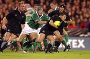 22 June 2002; Byron Kelleher of New Zealand evades the tackle of Ireland's Simon Easterby during the Summer Tour 2002 2nd Test match between New Zealand and Ireland at Eden Park in Auckland, New Zealand. Photo by Matt Browne/Sportsfile