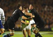 22 June 2002; Ronan O'Gara of Ireland is tackled by Norm Marwell, left, and Reuben Thorne of New Zealand during the Summer Tour 2002 2nd Test match between New Zealand and Ireland at Eden Park in Auckland, New Zealand. Photo by Matt Browne/Sportsfile